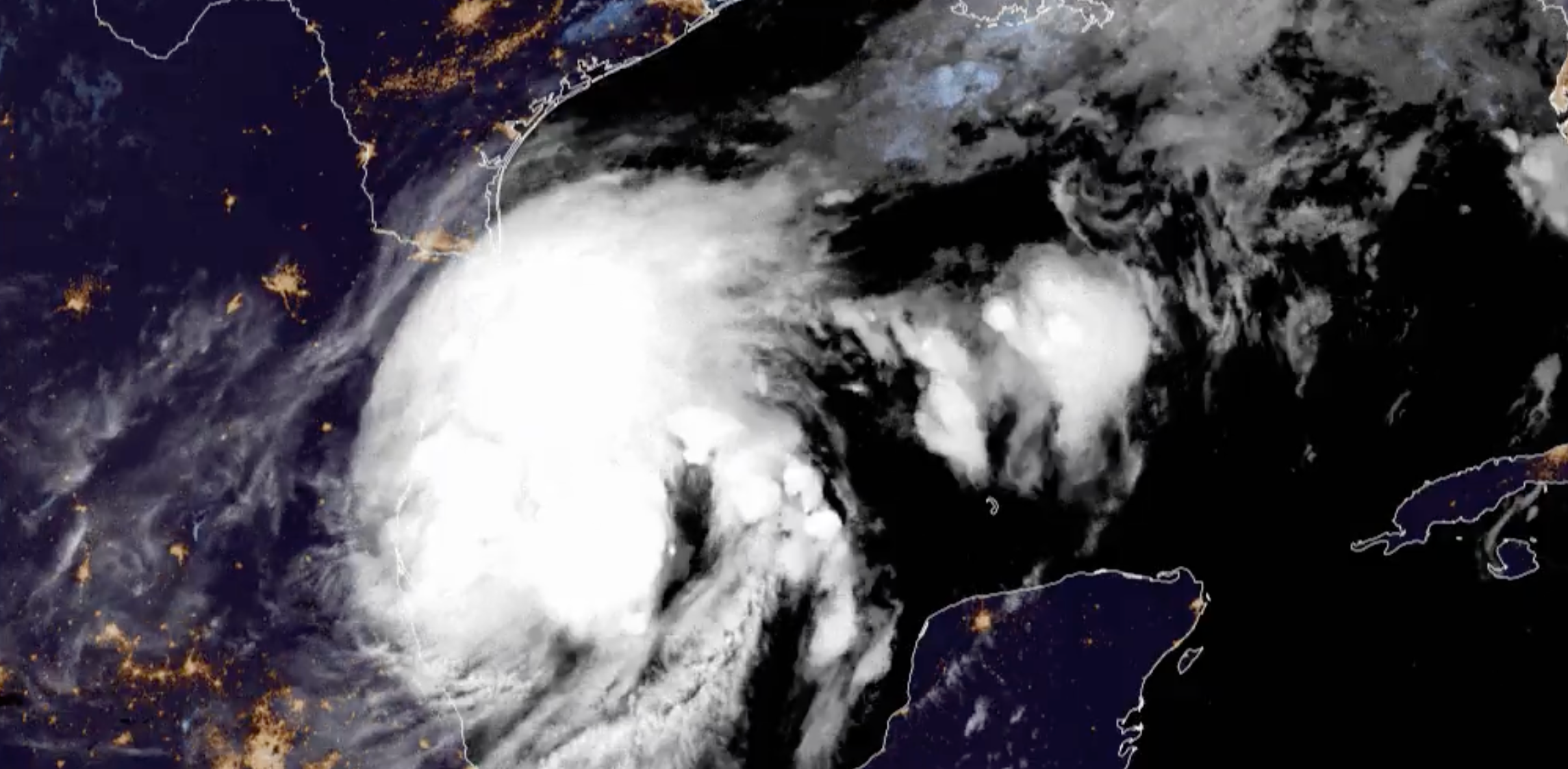 A NOAA satellite tracks the storm system in the Gulf of Mexico on Monday morning. The tropical cyclone is forecast to strengthen into a tropical storm on Monday, before becoming a hurricane later this week. It will lash Texas and Louisiana, bringing strong winds, rains, and flooding.